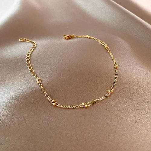 Bracelet à petites boules dorées ajustable - Sereine